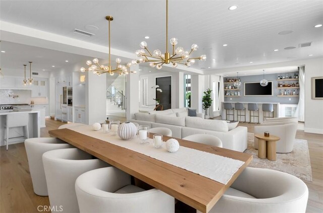 2401 Bayshore Dr, Newport Beach, CA 92663 - dining space featuring light wood-type flooring, a chandelier, and recessed lighting
