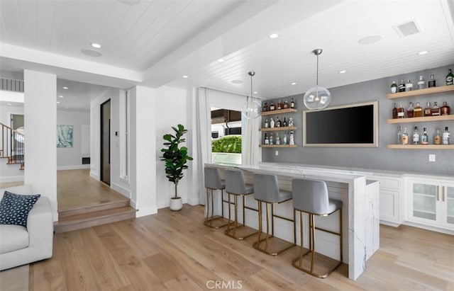 2401 Bayshore Dr, Newport Beach, CA 92663 - indoor wet bar with light wood-style flooring, recessed lighting, decorative light fixtures, wooden ceiling, and stairs