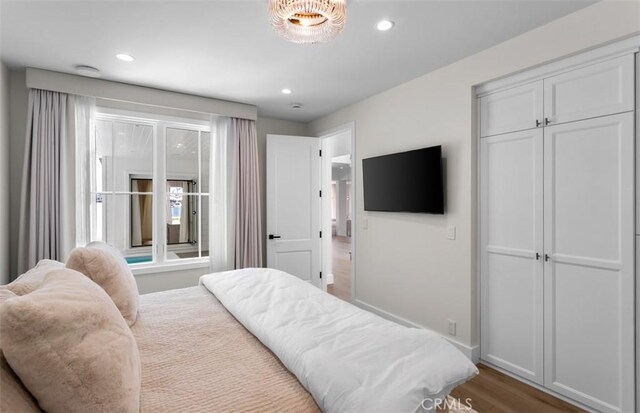 2401 Bayshore Dr, Newport Beach, CA 92663 - bedroom featuring wood finished floors, recessed lighting, baseboards, and a closet