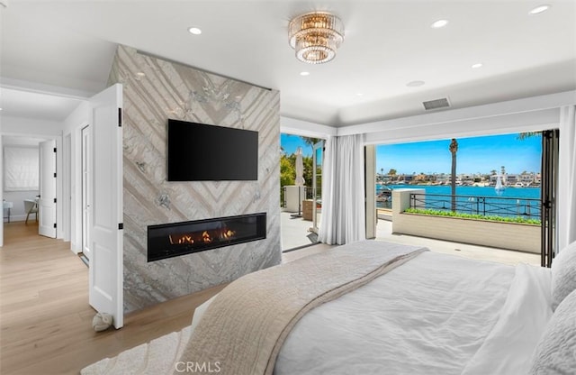 2401 Bayshore Dr, Newport Beach, CA 92663 - bedroom featuring wood finished floors, access to exterior, a fireplace, recessed lighting, and baseboards