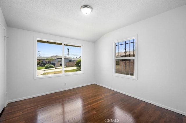 2931 W 137th St, Gardena, CA 90249 - spare room with plenty of natural light, wood finished floors, baseboards, lofted ceiling, and a textured ceiling