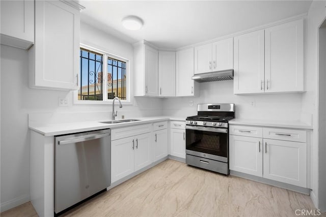 2931 W 137th St, Gardena, CA 90249 - kitchen featuring appliances with stainless steel finishes, under cabinet range hood, a sink, light countertops, and white cabinetry
