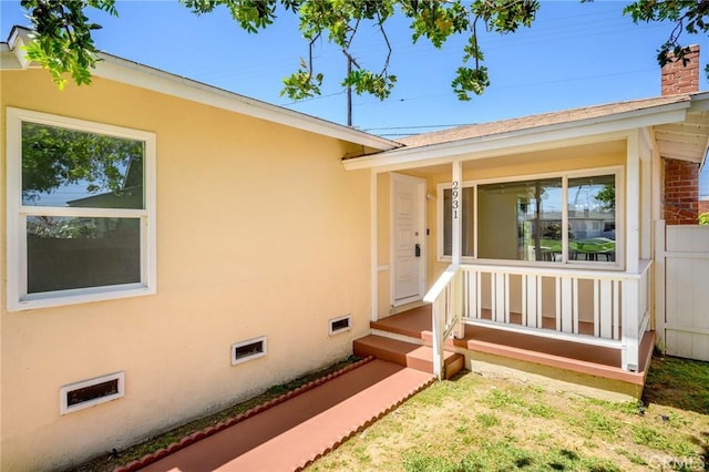 2931 W 137th St, Gardena, CA 90249 - property entrance with a chimney, stucco siding, and crawl space