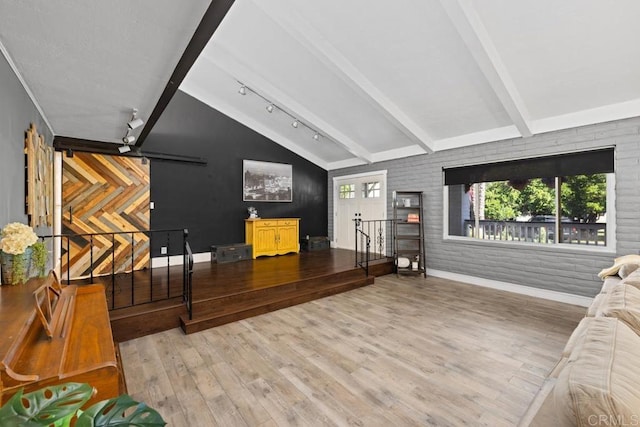 9739 Carta Ln, El Cajon, CA 92021 - living area featuring wood finished floors, rail lighting, and baseboards
