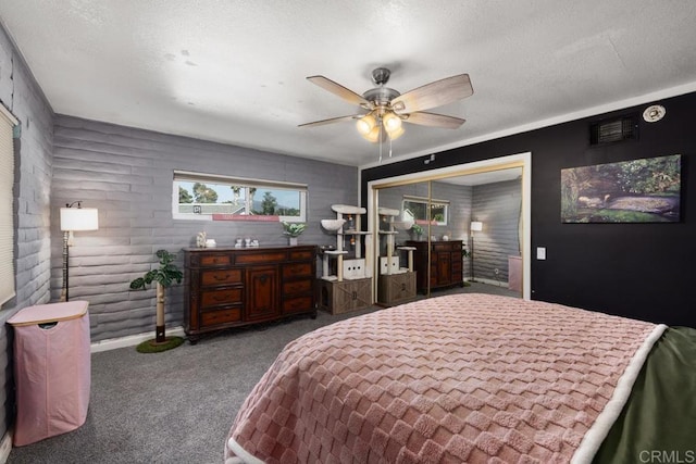 9739 Carta Ln, El Cajon, CA 92021 - bedroom with carpet floors, a closet, ceiling fan, and a textured ceiling