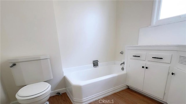 8739 Ralph St, Rosemead, CA 91770 - bathroom featuring a garden tub, wood finished floors, and toilet