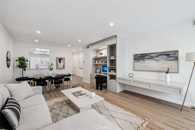 450 San Vicente Blvd Unit 203, Santa Monica, CA 90402 - living area featuring light wood finished floors, recessed lighting, and baseboards