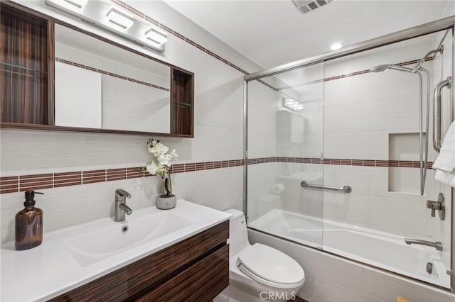 450 San Vicente Blvd Unit 203, Santa Monica, CA 90402 - bathroom with bath / shower combo with glass door, vanity, toilet, and tile walls