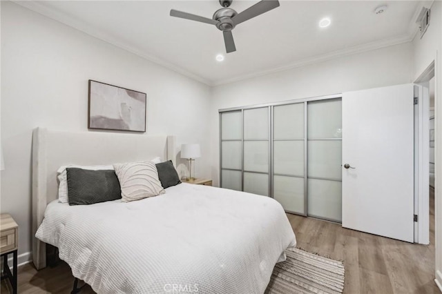 450 San Vicente Blvd Unit 203, Santa Monica, CA 90402 - bedroom with light wood-style flooring, ornamental molding, a ceiling fan, and recessed lighting