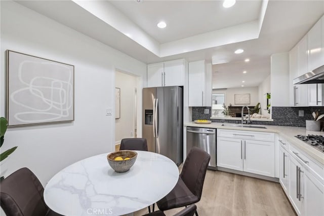 450 San Vicente Blvd Unit 203, Santa Monica, CA 90402 - kitchen with a sink, appliances with stainless steel finishes, tasteful backsplash, white cabinetry, and recessed lighting