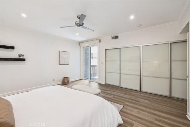 450 San Vicente Blvd Unit 203, Santa Monica, CA 90402 - bedroom with ornamental molding, wood finished floors, access to exterior, baseboards, and recessed lighting