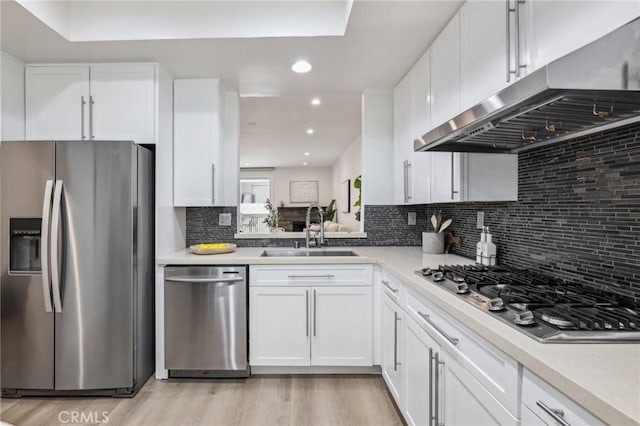 450 San Vicente Blvd Unit 203, Santa Monica, CA 90402 - kitchen featuring stainless steel appliances, a sink, under cabinet range hood, white cabinets, and light countertops