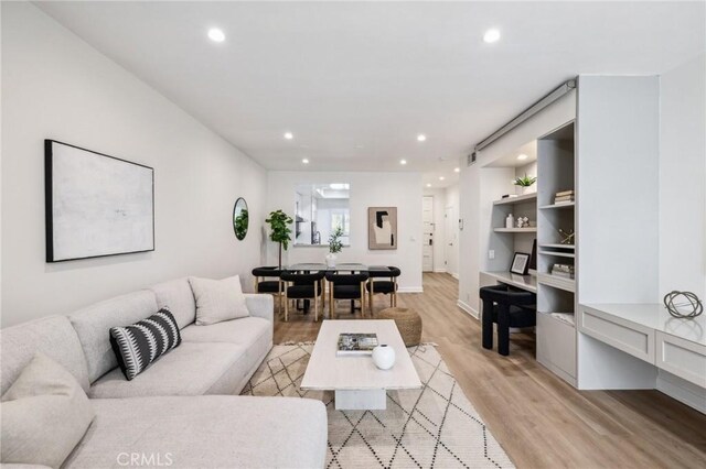 450 San Vicente Blvd Unit 203, Santa Monica, CA 90402 - living room featuring recessed lighting, light wood finished floors, and built in shelves