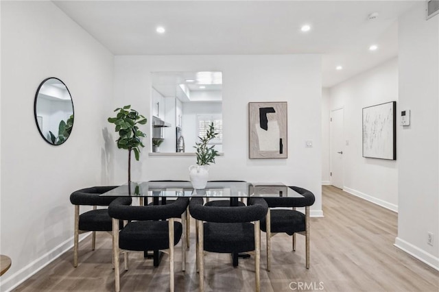 450 San Vicente Blvd Unit 203, Santa Monica, CA 90402 - dining room featuring wood finished floors, recessed lighting, and baseboards