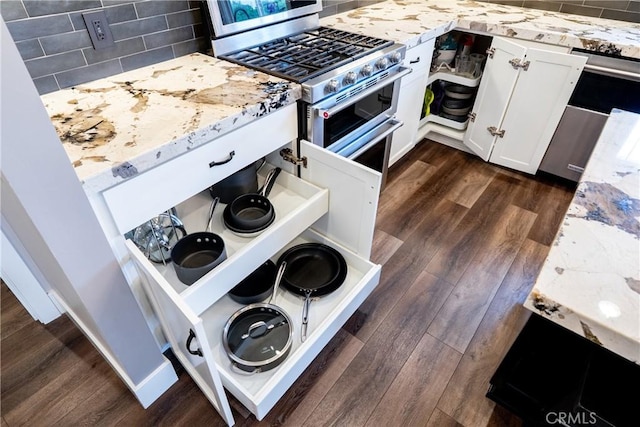 1534 Via Arroyo, Paso Robles, CA 93446 - kitchen featuring range with two ovens, light stone counters, decorative backsplash, and dark wood-style floors