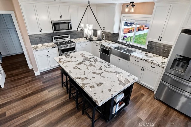 1534 Via Arroyo, Paso Robles, CA 93446 - kitchen with stainless steel appliances, a chandelier, a sink, and dark wood-style floors
