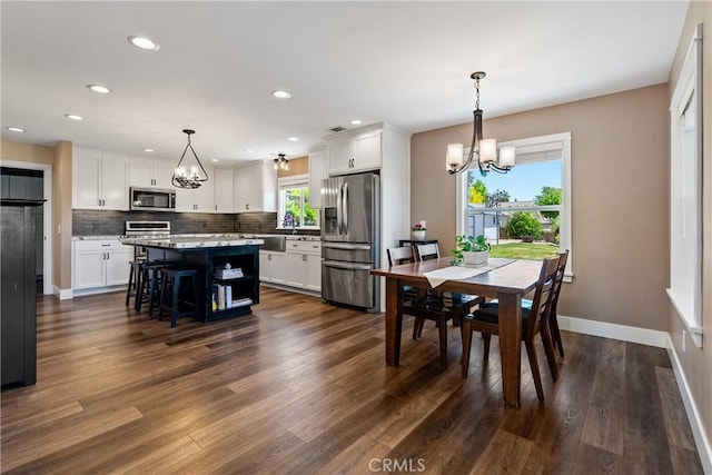 1534 Via Arroyo, Paso Robles, CA 93446 - dining area featuring a chandelier, healthy amount of natural light, dark wood-type flooring, and recessed lighting