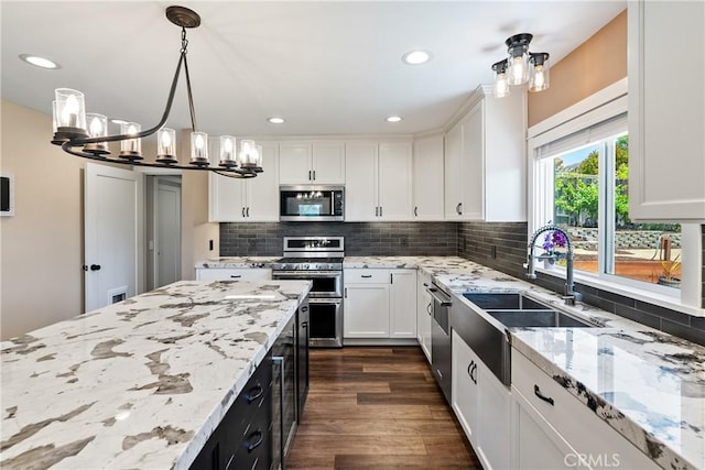 1534 Via Arroyo, Paso Robles, CA 93446 - kitchen with stainless steel appliances, a chandelier, a sink, white cabinetry, and recessed lighting