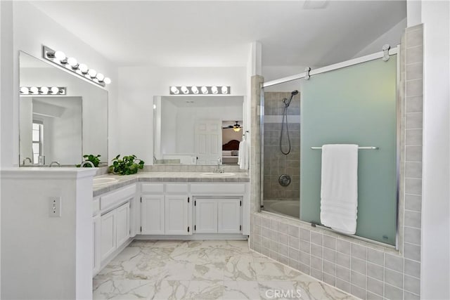 1534 Via Arroyo, Paso Robles, CA 93446 - full bathroom featuring double vanity, marble look tiles, and tiled shower / bath combo