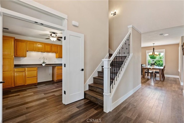 1534 Via Arroyo, Paso Robles, CA 93446 - staircase featuring wood finished floors, a chandelier, a high ceiling, ceiling fan, and baseboards