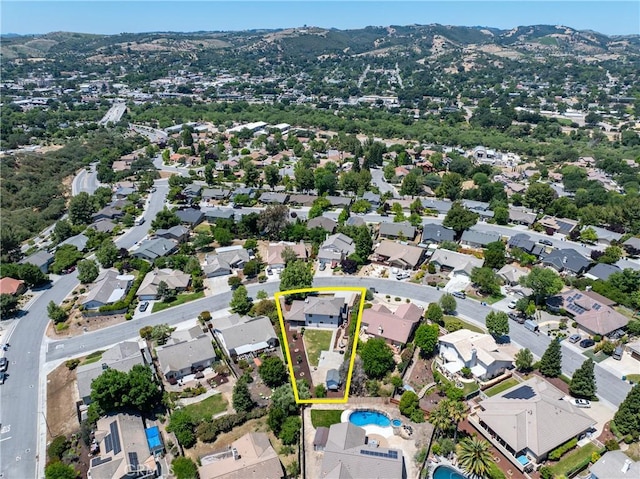 1534 Via Arroyo, Paso Robles, CA 93446 - aerial perspective of suburban area featuring property boundaries highlighted, mountains, and a pool area