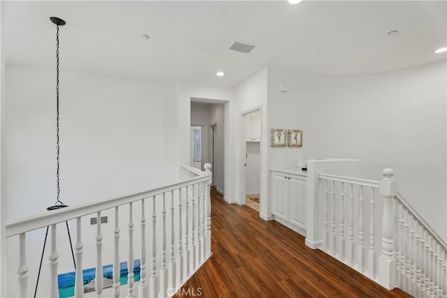 6249 Pacific Pointe Dr Unit 16, Huntington Beach, CA 92648 - hallway with an upstairs landing, recessed lighting, dark wood-style flooring, and baseboards