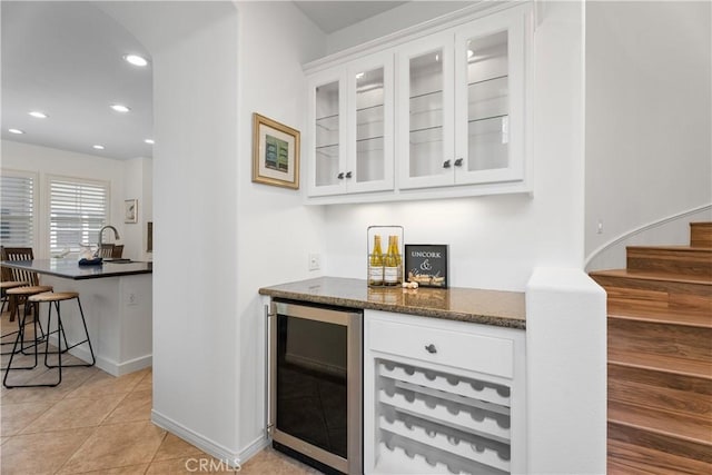 6249 Pacific Pointe Dr Unit 16, Huntington Beach, CA 92648 - indoor dry bar with wine cooler, recessed lighting, stairs, light tile patterned flooring, and baseboards