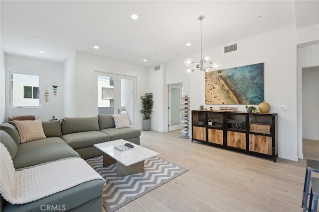 1746 Garfield Pl Unit 203, Los Angeles, CA 90028 - living room with recessed lighting, light wood-style floors, a chandelier, and baseboards