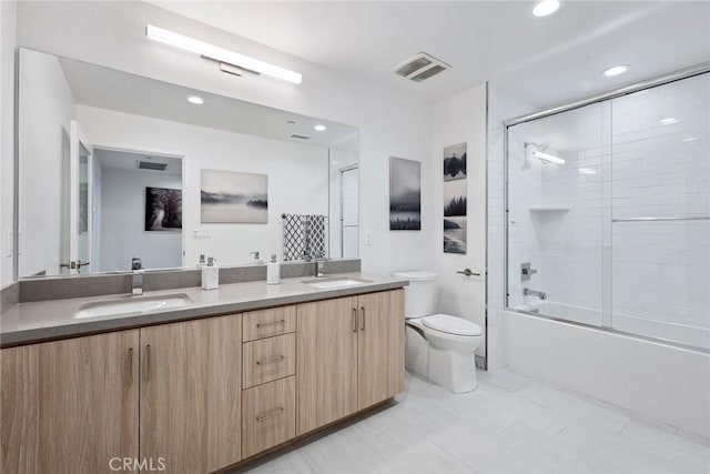 1746 Garfield Pl Unit 203, Los Angeles, CA 90028 - bathroom featuring toilet, double vanity, bath / shower combo with glass door, and recessed lighting