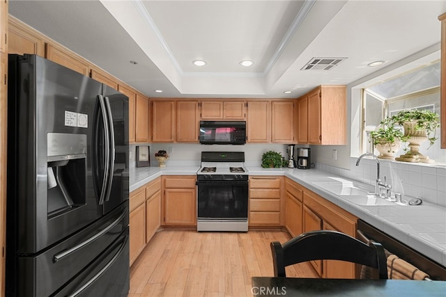 15058 Providence Ln, North Hills, CA 91343 - kitchen featuring black appliances, a sink, a raised ceiling, light wood finished floors, and recessed lighting