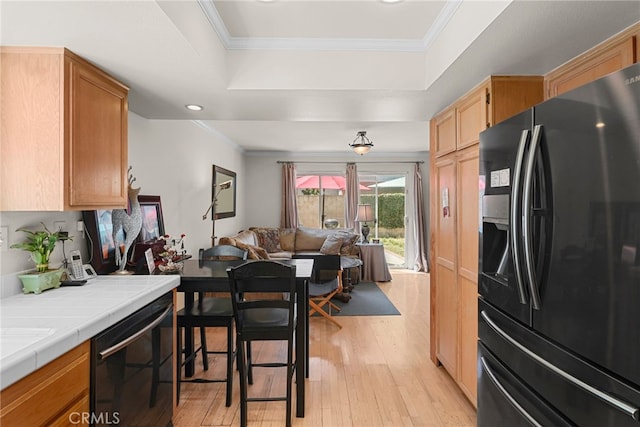 15058 Providence Ln, North Hills, CA 91343 - kitchen featuring black appliances, tile counters, a raised ceiling, light wood finished floors, and open floor plan