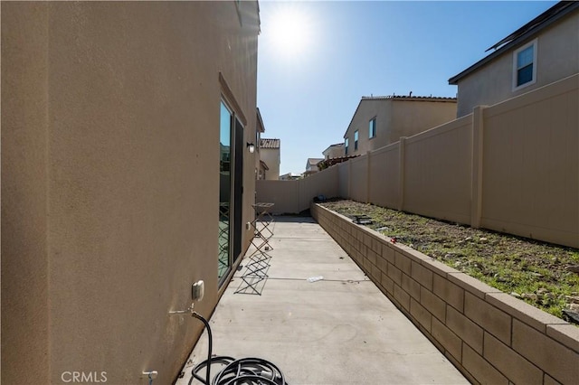 956 W Clover Ave, Rialto, CA 92376 - fenced backyard featuring a patio area