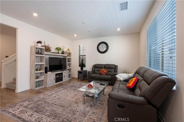 956 W Clover Ave, Rialto, CA 92376 - living room featuring light wood finished floors, stairway, recessed lighting, and baseboards