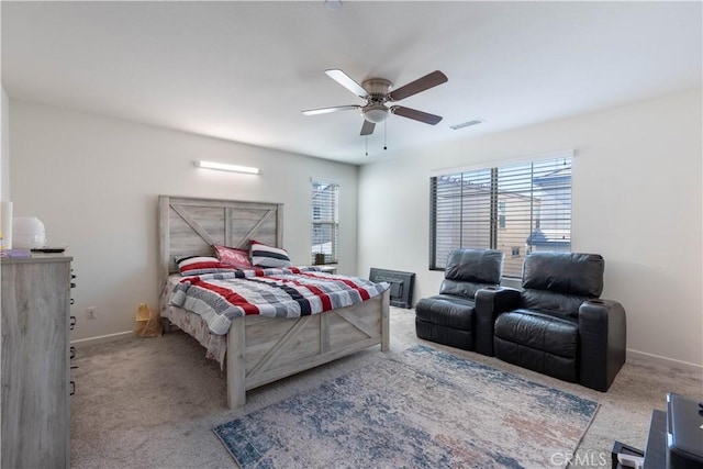 956 W Clover Ave, Rialto, CA 92376 - bedroom featuring carpet floors, multiple windows, baseboards, and ceiling fan