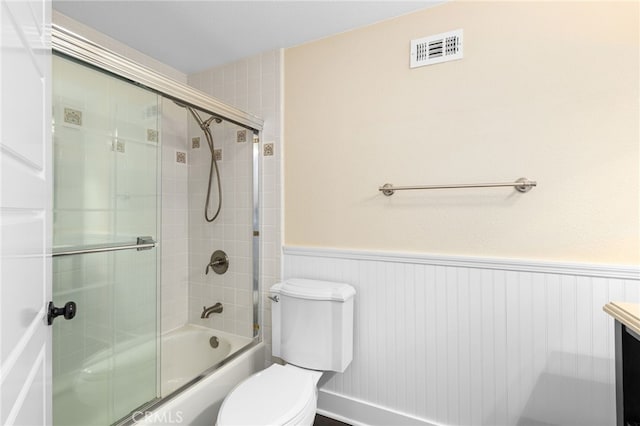 8729 Hillside Rd, Rancho Cucamonga, CA 91701 - full bathroom featuring toilet, enclosed tub / shower combo, a wainscoted wall, and vanity