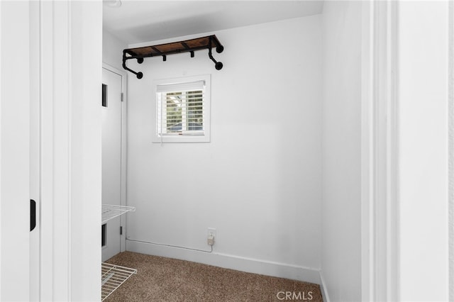 8729 Hillside Rd, Rancho Cucamonga, CA 91701 - mudroom with dark carpet and baseboards