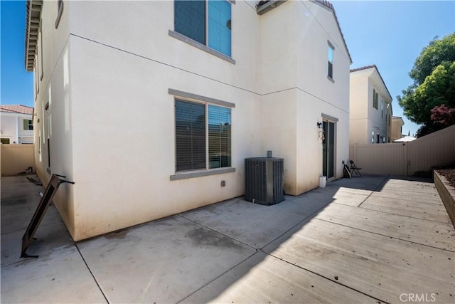980 W Jasmine Way, Rialto, CA 92376 - back of house with stucco siding, a patio area, and central AC