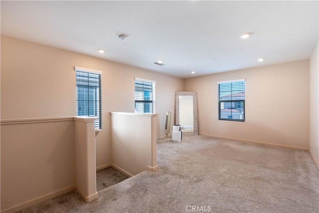 980 W Jasmine Way, Rialto, CA 92376 - spare room with healthy amount of natural light, carpet floors, baseboards, recessed lighting, and a smoke detector