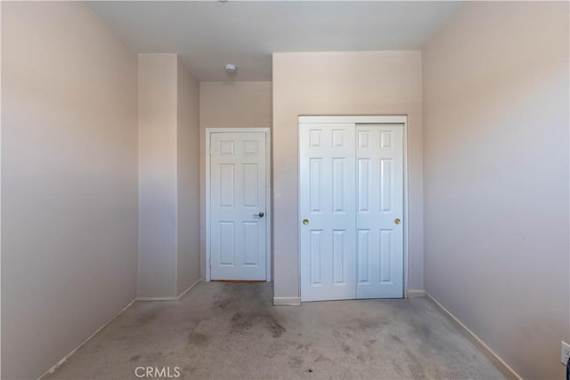 980 W Jasmine Way, Rialto, CA 92376 - unfurnished bedroom featuring carpet, a closet, and baseboards