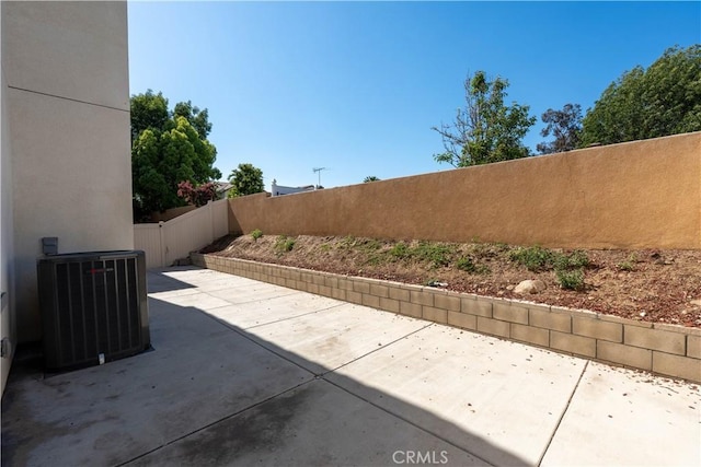 980 W Jasmine Way, Rialto, CA 92376 - fenced backyard with a patio and central AC unit
