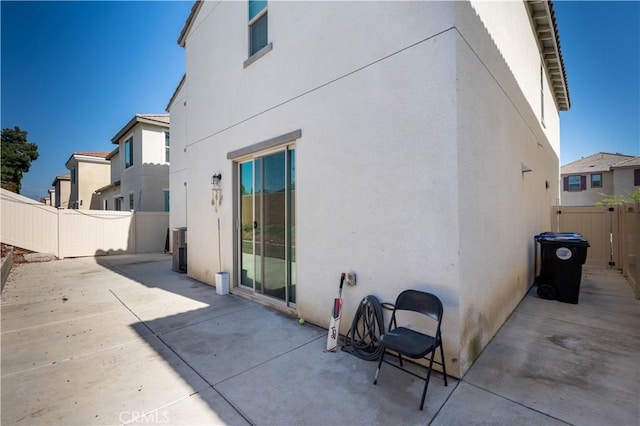 980 W Jasmine Way, Rialto, CA 92376 - back of house featuring stucco siding and a patio area