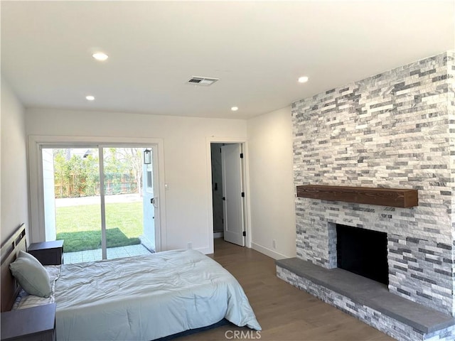 16913 Covello St, Van Nuys, CA 91406 - bedroom with access to exterior, wood finished floors, recessed lighting, and a stone fireplace