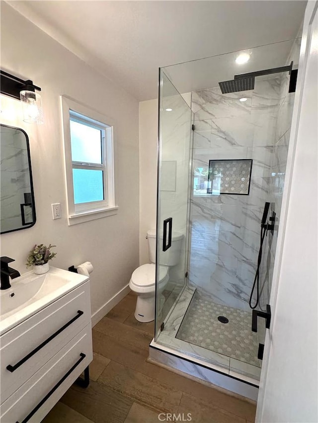 16913 Covello St, Van Nuys, CA 91406 - full bath with a marble finish shower, vanity, and wood finished floors