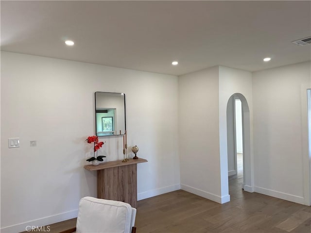 16913 Covello St, Van Nuys, CA 91406 - empty room featuring arched walkways, wood finished floors, and recessed lighting