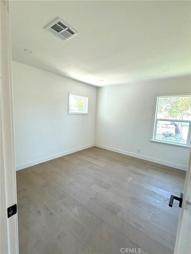 16913 Covello St, Van Nuys, CA 91406 - empty room with hardwood / wood-style floors and baseboards