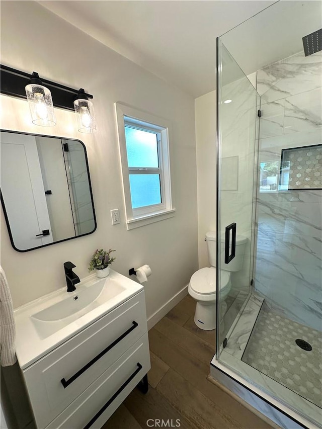 16913 Covello St, Van Nuys, CA 91406 - bathroom with a stall shower, vanity, and wood finished floors