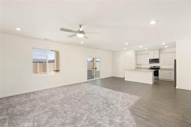 42499 Aruba Ct, Indio, CA 92201 - unfurnished living room featuring recessed lighting, baseboards, a ceiling fan, and dark wood-type flooring