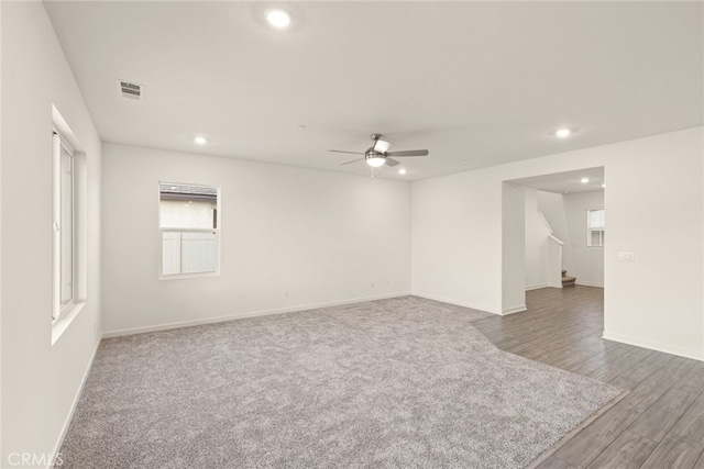 42499 Aruba Ct, Indio, CA 92201 - carpeted empty room featuring a ceiling fan, recessed lighting, stairs, baseboards, and wood finished floors