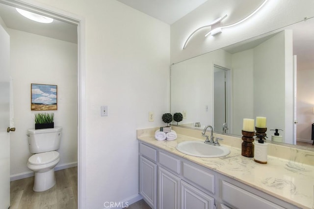 14 Fernwood Ct, Pittsburg, CA 94565 - bathroom with vanity, wood finished floors, toilet, and baseboards