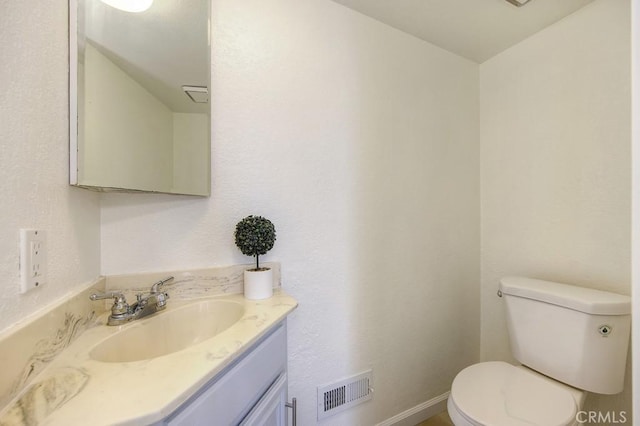 14 Fernwood Ct, Pittsburg, CA 94565 - bathroom featuring vanity, toilet, and baseboards